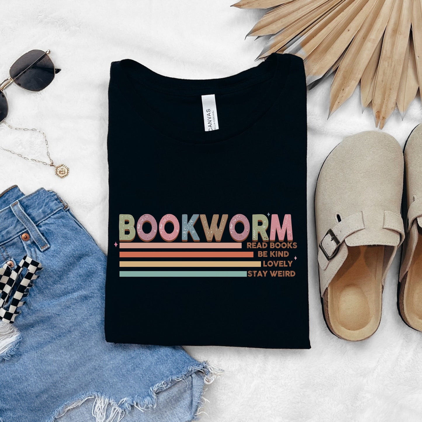 The word &quot;Bookworm&quot; in pastel print along with &quot;Read books, be kind, lovely, stay weird&quot;