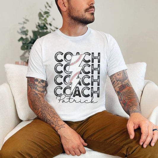 Custom Retro Style Baseball Coach with a baseball lightning rod, the name can be added below in cursive font on a BellaCanvas Shirt.